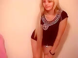 Blonde Eva2209 in a short black dress