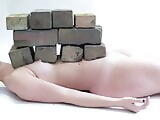 Sarah Sudhoffs nipple is stuck under a brick