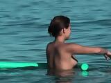 Playful chicks demonstrate their tits in the nude beach