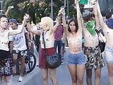 Topless Argentinian protesters fighting voyeurs