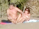 Lusty mature momma gets her shaved taco fingered on beach