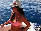Black hair milf with big tits cruising on a boat