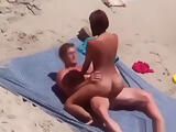Tanned couple has an amazing sex on the beach