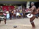 Busty African girl and fat guy doing some sort of show 2